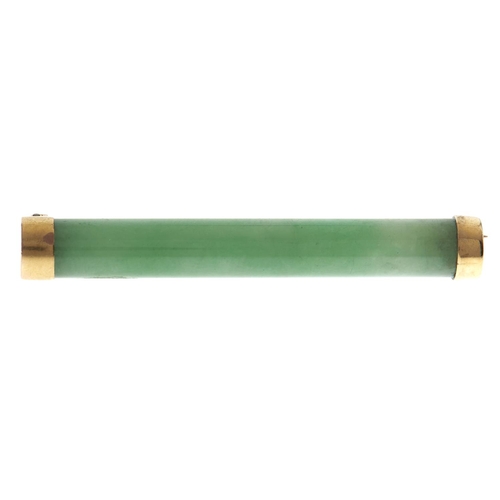 148 - A Chinese jadeite baton brooch, with gold terminals, early 20th c, marked W H and a number, marks ru... 