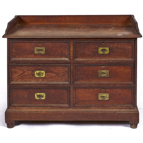 1506 - A Victorian oak washstand, c1880, with three quarter gallery above six short panelled drawers with r... 