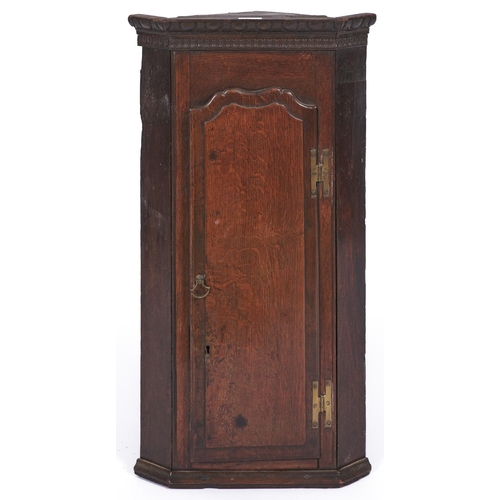 1524 - A splay fronted oak hanging corner cabinet, 76cm h; 26 x 41cm