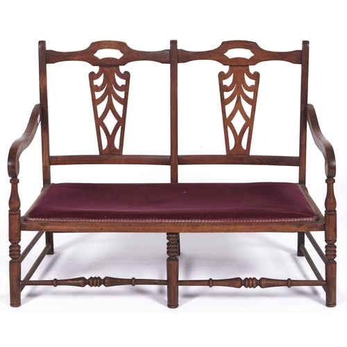 1525 - An Edwardian beech twin chair back settee, with padded seat, 97cm l