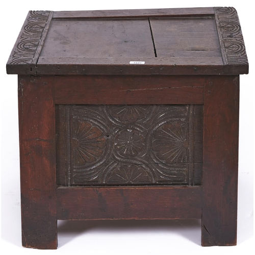 1547 - A small oak blanket chest, the hinged top panelled with carved borders, the front with panel carved ... 