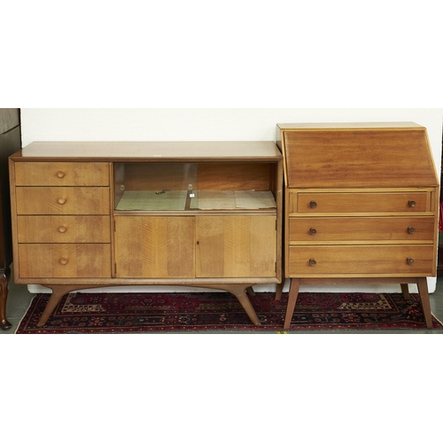1561 - A mid century walnut  bureau, 1950s, the fall flap revealing interior of two short drawers and pigeo... 