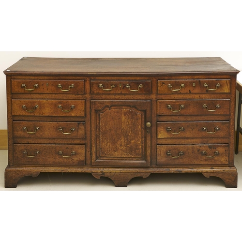 1596 - A George III oak dresser, North Wales, late 18th / early 19th c, fitted with drawers and a central d... 