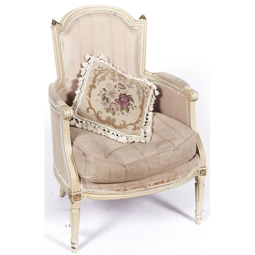 1597 - A French painted bergere, 19th c, in Louis XVI style, the arched and curved, padded back with gilt l... 