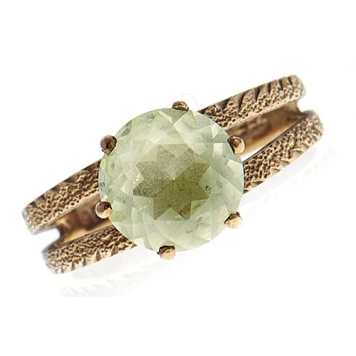 217 - A green stone ring, in gold marked 9ct, 3.2g, size M