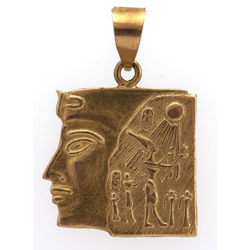 230 - An Egyptian gold mask pendant, control mark, 3.2g