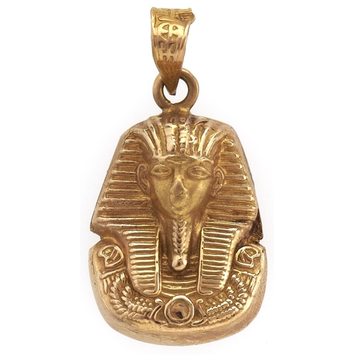 231 - An Egyptian gold Tutankhamun mask pendant, 2.5g