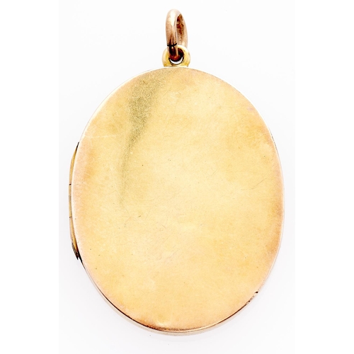 249 - An Edwardian gold locket, c1910, quite plain, marked 15ct, 12g