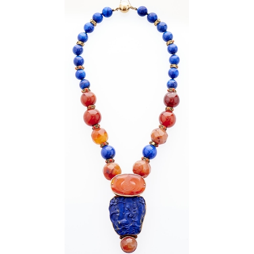 264 - A Chinese carved lapis lazuli and cornelian pendant, the integral necklet of lapis lazuli and round ... 