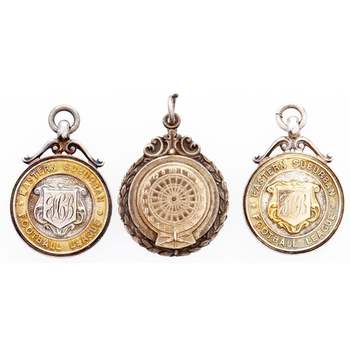 266 - Three parcel gilt silver sporting prize fob shields, including Eastern Suburban Football League Firs... 