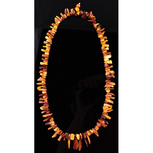 299 - An amber necklace, 119g