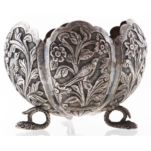 336 - An Indian flower shaped silver repousse sugar bowl, late 19th c, on three snake feet, 65mm h, 2ozs 1... 