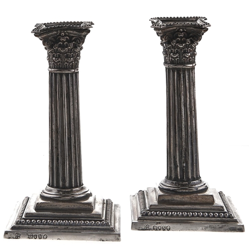 349 - A pair of Victorian silver dwarf columnar candlesticks, on stepped square foot, nozzles, 15.5cm h, L... 