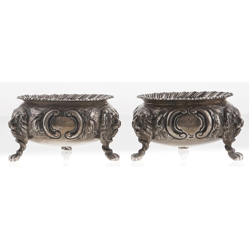 357 - A pair of Victorian silver salt cellars, chased with flowers, on three lion mask and paw feet, 80mm ... 