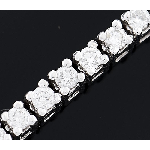 617 - A diamond line bracelet,  diamonds weighing approx 1.77ct, in white gold, 18.5cm l, 11g... 