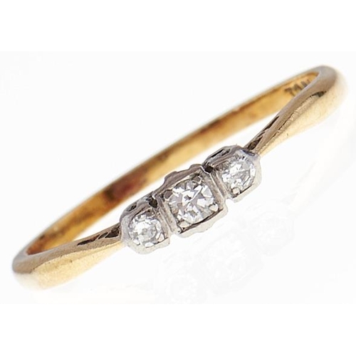 67 - A three stone diamond ring, in gold marked 18ct, 2g, size O