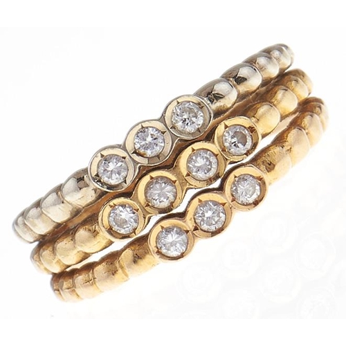 75 - A Portuguese diamond ring, in gold, control mark for 18ct to each of the three hoops, 4g, size M... 