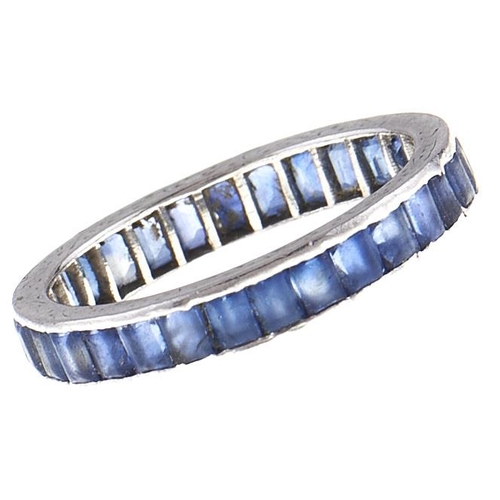 89 - A sapphire eternity ring, platinum mount, unmarked, 3.3g, size L