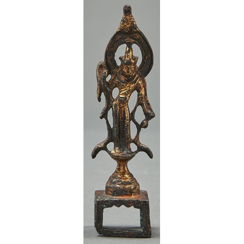983 - A gilt bronze sculpture of Guanyin, Tang dynasty or later, open mandorla and waisted plinth raised o... 