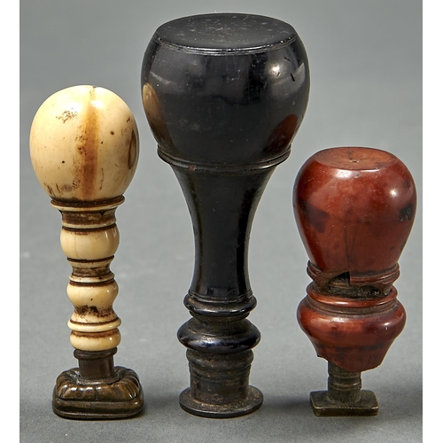 997 - Three brass hand seals, 19th c, one with  brass armorial matrix and ebonised handle, the turned bone... 