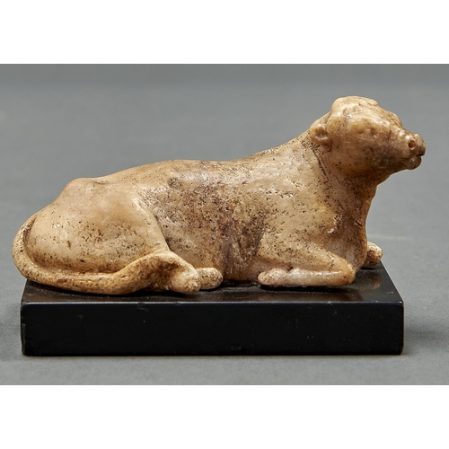 998 - A miniature marble sculpture of a recumbent cow, 19th c, on rectangular slate base, 10.5cm l... 