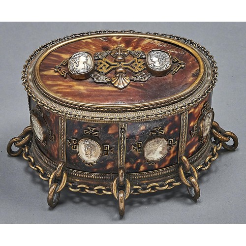 1070 - An oval Palais Royal cameo mounted tortoiseshell brass chain bordered jewel casket, late 19th c, plu... 