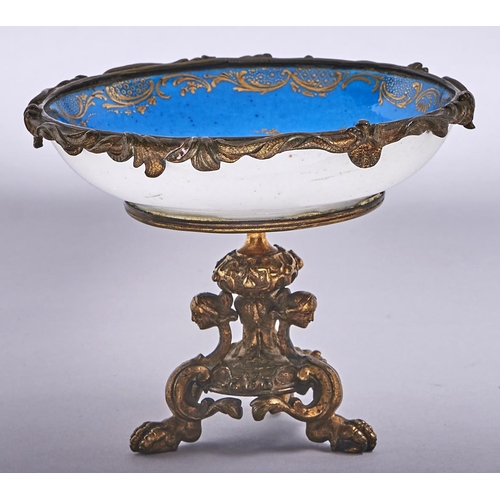 567 - A French ormolu mounted Sevres style tazza, late 19th c, incorporating a saucer, painted with putto ... 