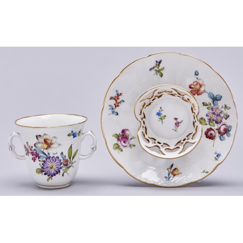568 - A Vienna style osier moulded trembleuse chocolate cup and saucer, 20th c, painted with flowers, sauc... 