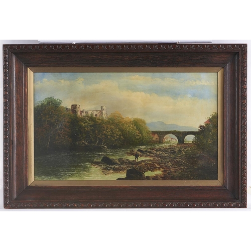 1506 - J Stanton (early 20th c) - An Angler on a Riverbank near a Castle, signed, oil on canvas, 29 x 51cm... 