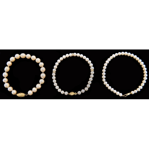 301 - Three cultured pearl bracelets, with 14ct gold or gold marked 14ct, 30.6g