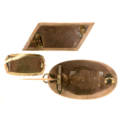 76 - Three English mourning brooches, early 19th c, of gold or gold and enamel with split pearl surround ... 