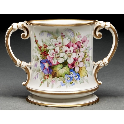 1003 - A Royal Worcester loving cup, 1879, painted with flowers and, to the other side, gilt arms and inscr... 