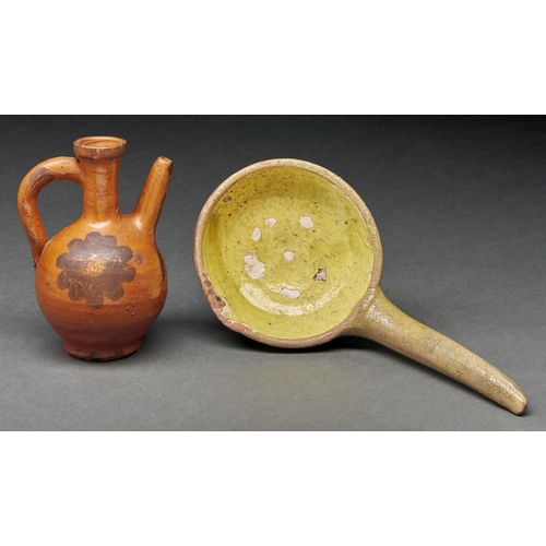 1004 - A  lead glazed earthenware ladle, 19th c, with yellow slip bowl 26cm l and a  lead glazed ... 