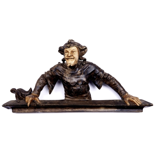 1107 - A painted terracotta jester figural wall applique attributed to Goldscheider, Vienna, c1900,  35cm h... 