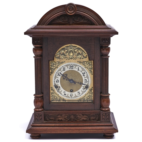 1111 - A German walnut bracket clock, c1910,  the breakarched brass dial with matted centre and silvered ch... 