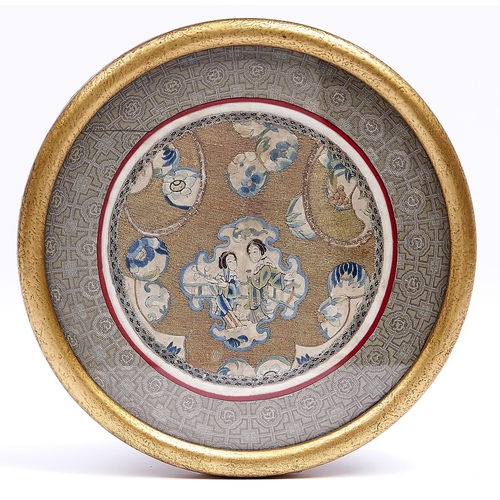 1121 - A Chinese embroidered silk and metal thread roundel in woven silk surround, early 20th c, 20.5cm dia... 