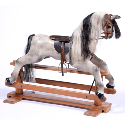 1316 - A painted wood rocking horse, in early 20th c style, 88cm h