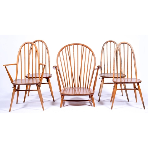 1318 - An Ercol armchair and four dining chairs