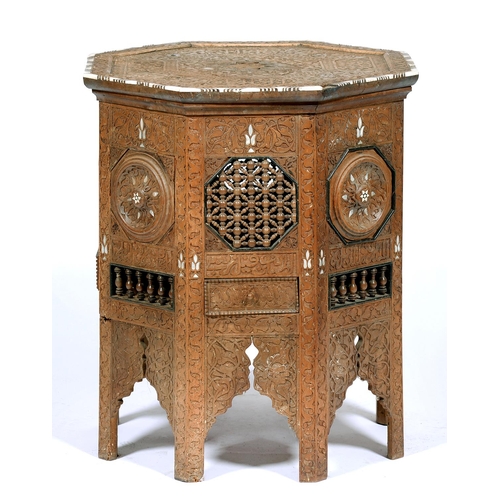 1323 - An Anglo Indian mother of pearl and bone inlaid and carved wood octagonal table, late 19th c, with g... 