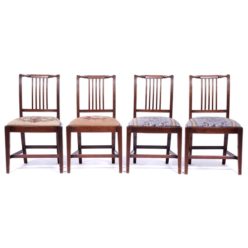 1335 - A set of four mahogany dining chairs, c1830, the top rails with central tablets flanked by tapered t... 