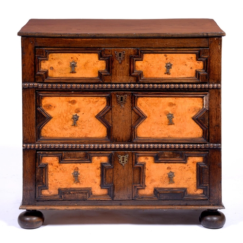 1349 - An oak and burr walnut geometric moulded chest of drawers, 19th/early 20th c,  in William III s... 