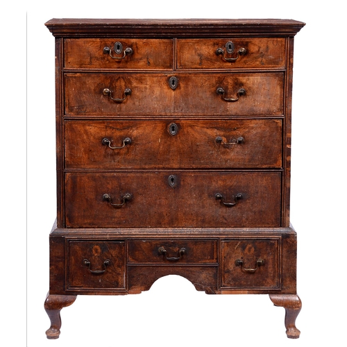 1353 - A Queen Anne walnut and featherbanded chest-on-stand,  the moulded cornice above two short and three... 