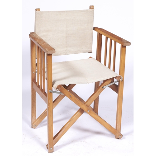 1360 - A set of eight beech 'director's' chairs, late 20th c, with cream canvas backs and seats... 