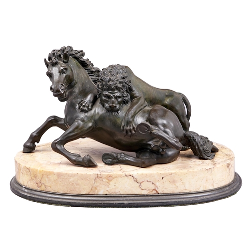 184 - An Italian bronze sculpture of a lion attacking a horse, Rome, c1840, after the antique, on oval mar... 