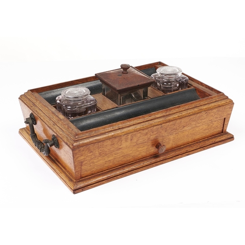 186 - An early Victorian bronze mounted oak and ebony inkstand, attributed to Gillows, of sarcophagus shap... 