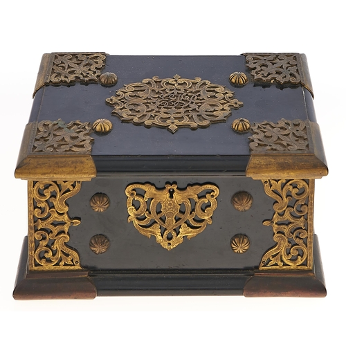 188 - A Victorian gilt brass mounted ebony jewel casket, the pierced and engraved mounts and studs to the ... 