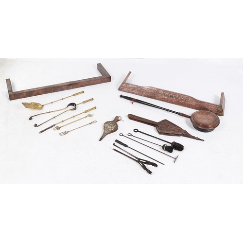 217 - Miscellaneous steel and brass fire irons, two pairs or wooden hearth bellows and two Edwardian sheet... 