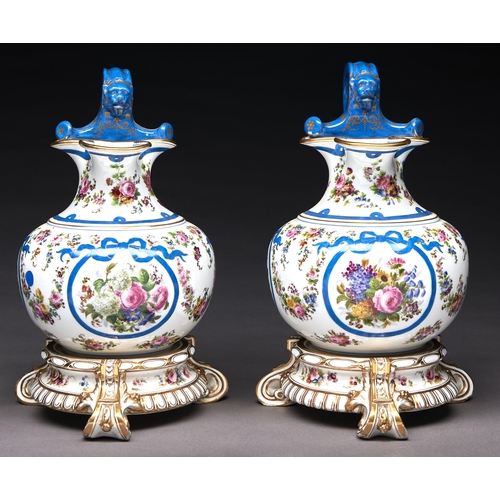 228 - A pair of French porcelain ewers in the form of a trilobed oinochoe, mid 19th c, painted with flower... 