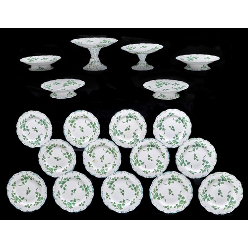 234 - A Minton bone china dessert service, 1850 and 1892, printed and painted in green monochrome with ivy... 