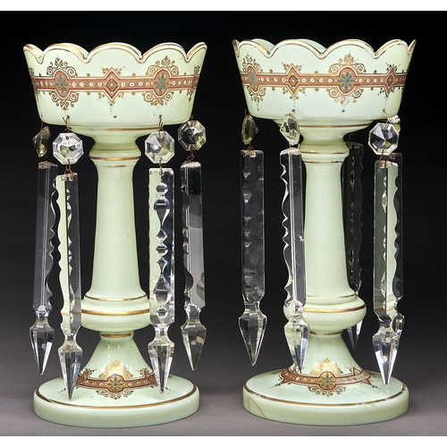 243 - A pair of primrose glass lustres, c1860, with two gilt bands of pearls, 34cm h